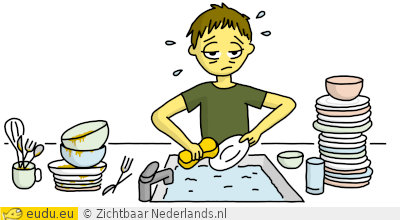 Een jongen wast stapels borden af.
